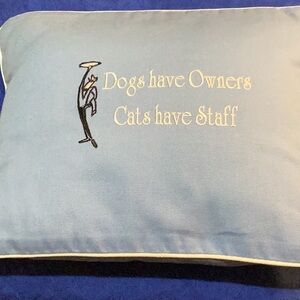 “Cat” pillow trimmed in white with “Dogs have Owners” “Cats have Staff”.